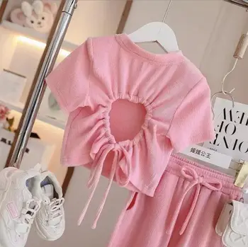 Търговия на дребно 2023 Нови бебешки момичета тийнейджърска лятна мода розови комплекти, обратно кухи отгоре+ панталони 3-10T